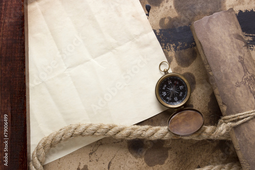 Roll of parchment with a compass