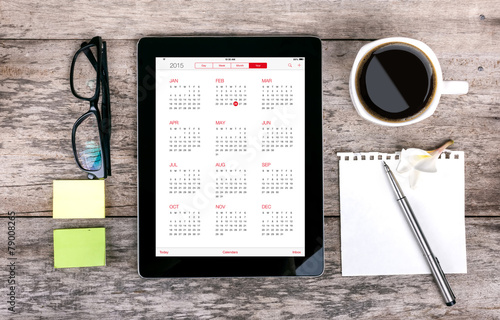 digital tabletdigital tablet as a calendar  and coffee cup wit