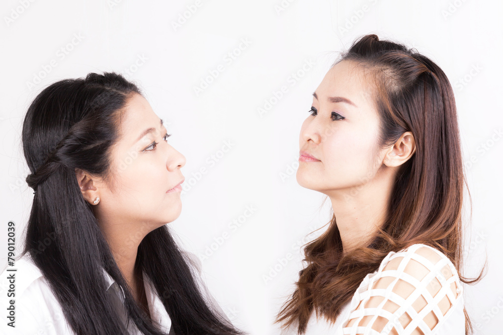 Two aggressive womenisolated on a white background Two aggressive womenisolated on a white background