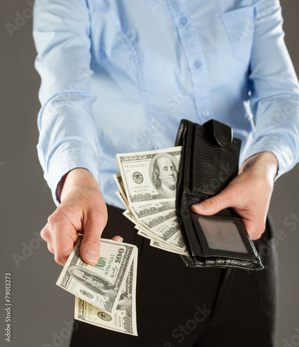 Woman's hands paying money