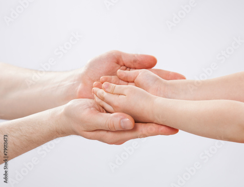 Parent s and child s hands holding together  closeup shot