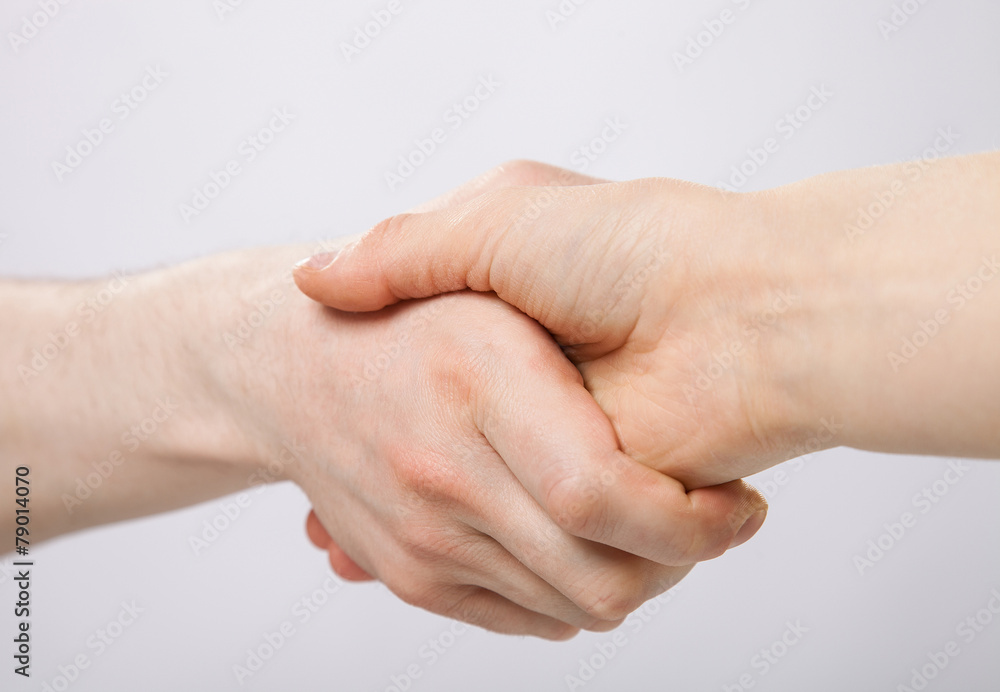 Handshake on grey background Handshake on grey background