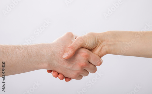 Handshake on grey background