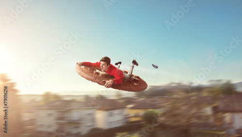 Φωτογραφία Flying guy on a giant biscuit
