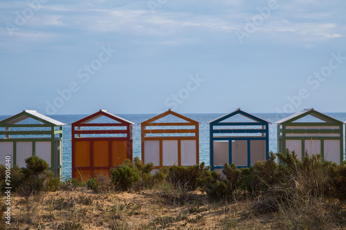 Colorful beach huts in good weather
