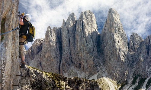 climber on via ferrata or klettersteig in Italy photo