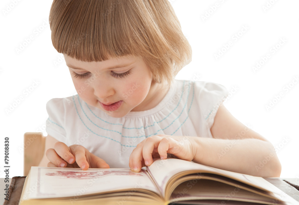 Pretty little girl reading an interesting book Pretty little girl reading an interesting book