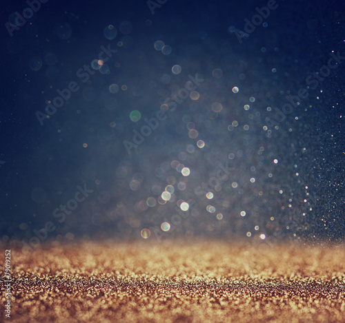 Fotografie glitter vintage lights background. light silver and black. defoc