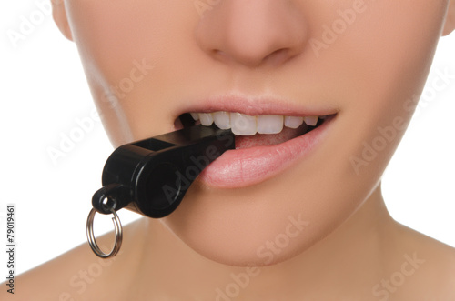 Canvas Print woman holding whistle in his mouth closeup