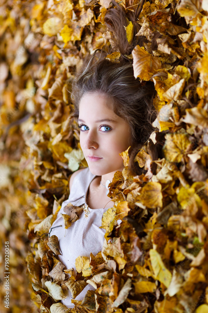 Beautiful girl in a yellow leaves Beautiful girl in a yellow leaves
