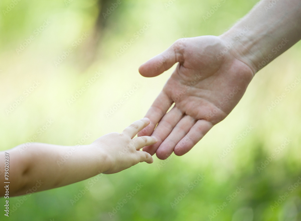 Child's and gather's hands holding together Child's and gather's hands holding together