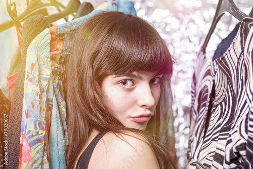 perky teenage girl and her wardrobe, toned image, bokeh, light l