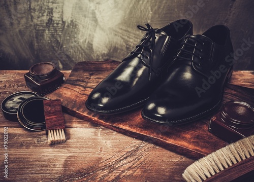 Shoe care accessories on a wooden table