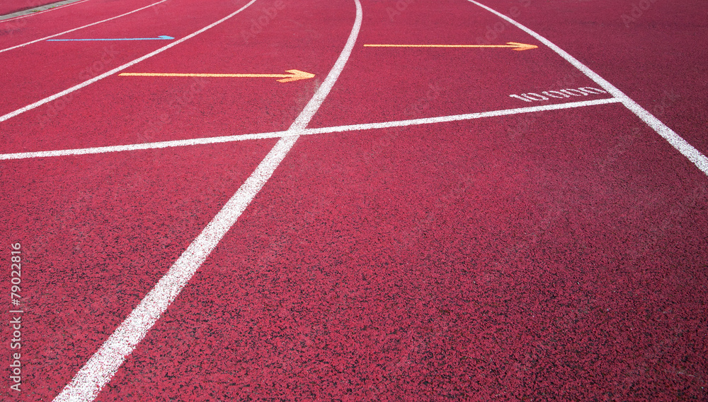 Red running field track with arrows and lines.