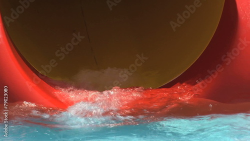 Funny dives from water slide in aquatic park