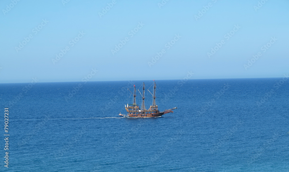 Fototapeta premium Vintage wooden old ship in blue sea