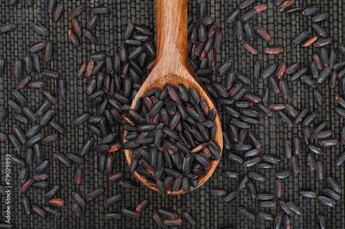 Black Nerone Rice in wooden spoon photo