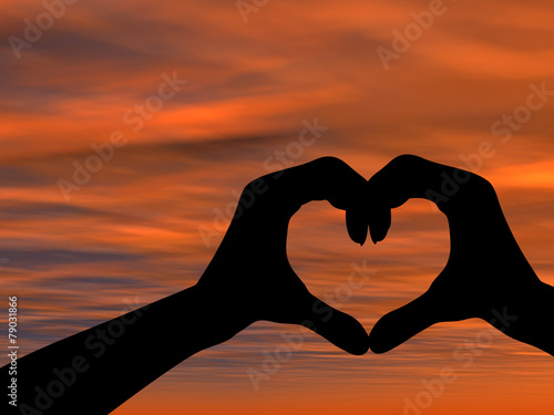 Conceptual heart shape sunset silhouette