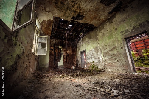 Dark room interior with damaged roof