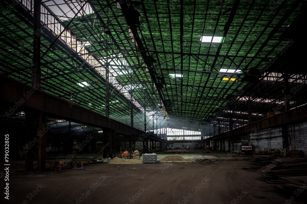 Large industrial hall with low light