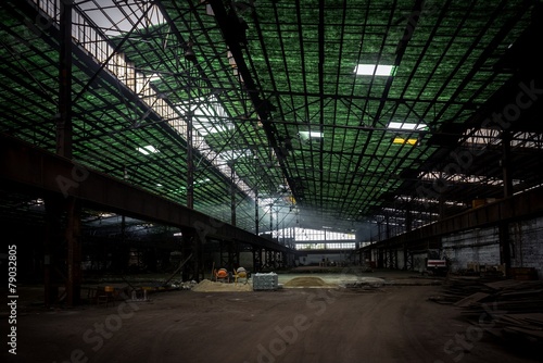 Large industrial hall with low light