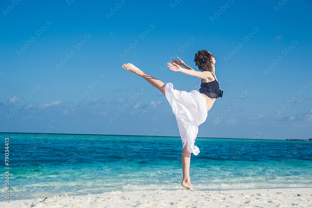 young girl dance at tropical beach young girl dance at tropical beach