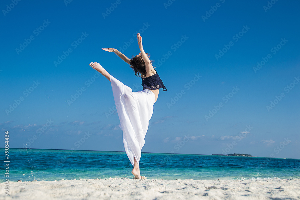 young girl dance at tropical beach, maldives young girl dance at tropical beach, maldives