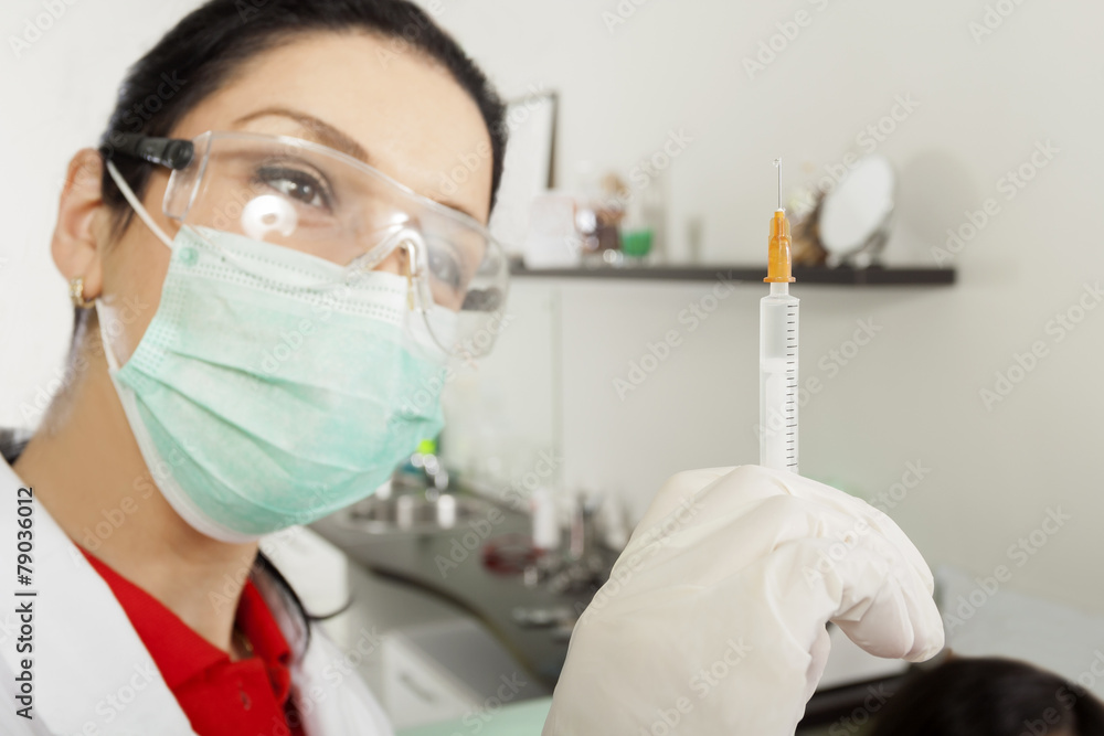Medical worker and syringe Medical worker and syringe