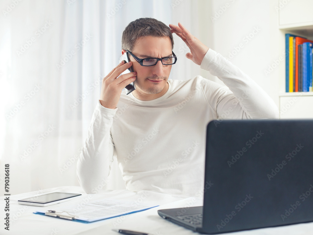 Portrait of young businessman scratching his head Portrait of young businessman scratching his head
