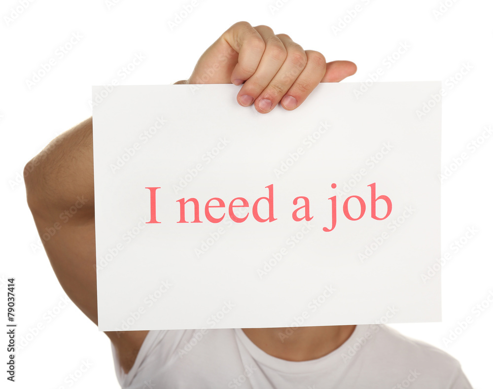 Sheet of paper with inscription I need a job in male hand Sheet of paper with inscription I need a job in male hand