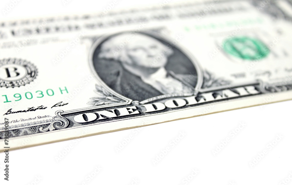 Close up of one dollar isolate on white background.