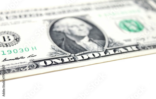 Close up of one dollar isolate on white background.