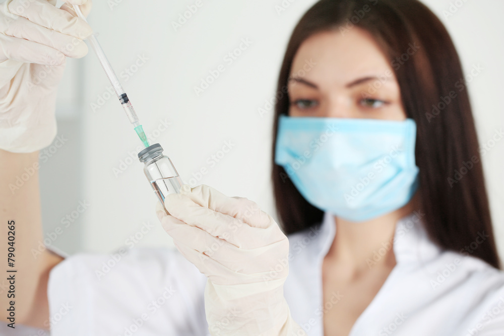 Ampule and syringe in hands of doctor Ampule and syringe in hands of doctor