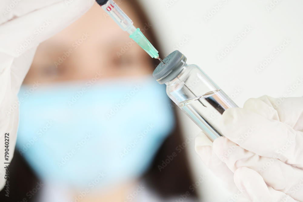 Ampule and syringe in hands of doctor Ampule and syringe in hands of doctor