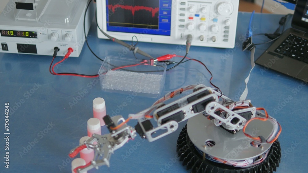 Experimental robot adds vials in a box Experimental robot adds vials in a box