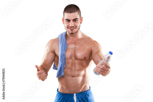 Muscular Man With A Towel And Water