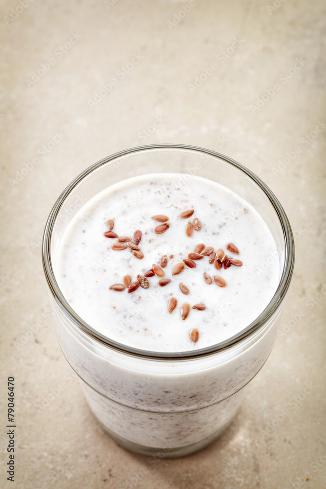 Glass of greek yogurt with crushed flax seeds Glass of greek yogurt with crushed flax seeds
