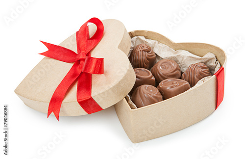 Chocolate candy in a box with a red bow