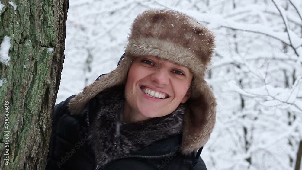 Portrait of a young woman in winter forest, slow motion Portrait of a young woman in winter forest, slow motion