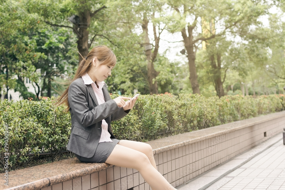 Fototapeta premium Asian business woman use cellphone
