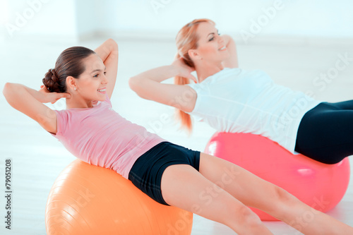 Mother and teenage girl at sports club