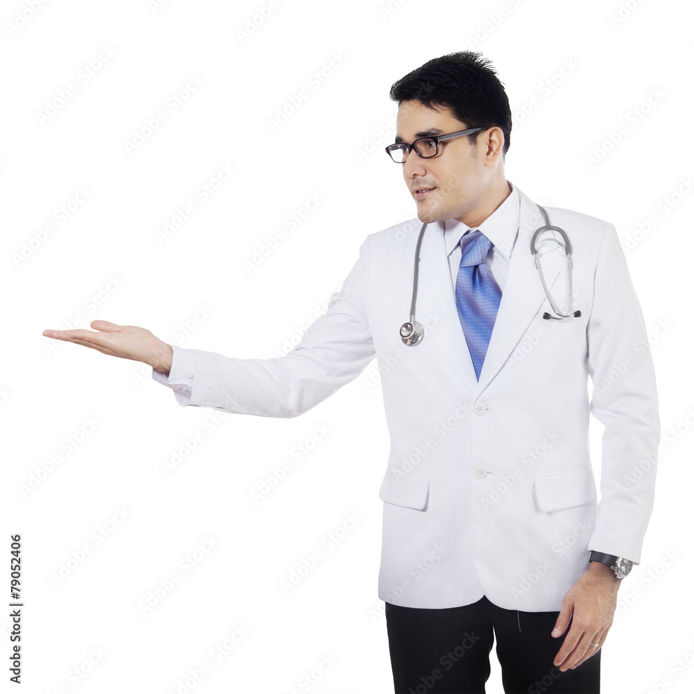 Male doctor with presentation hand gesture Male doctor with presentation hand gesture