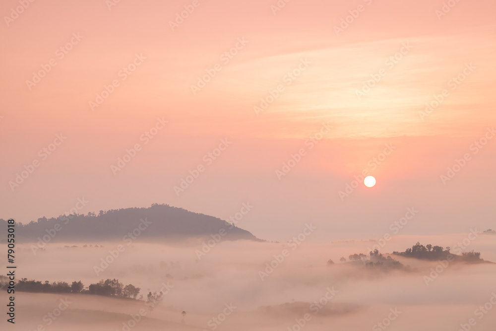 Fog covered mountains And the Rising Sun