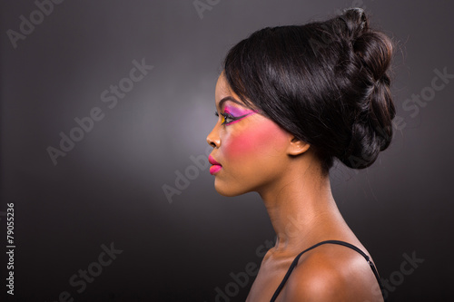 young african woman with colorful make-up