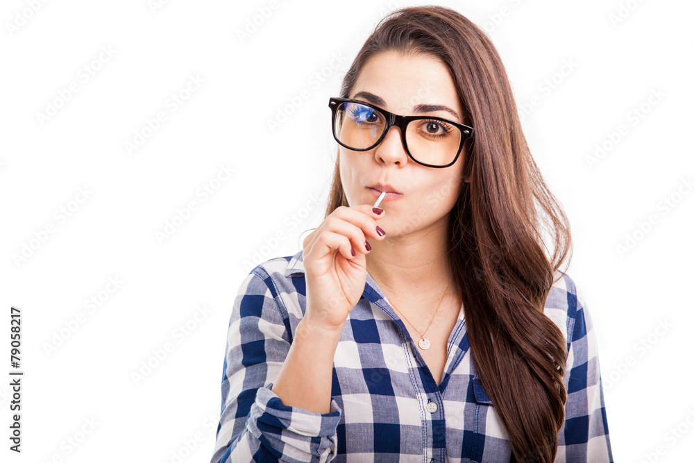 Hipster girl eating a lollipop Hipster girl eating a lollipop