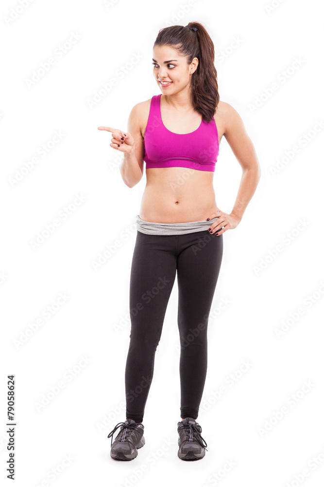 Athlete pointing at copy space Athlete pointing at copy space