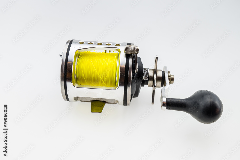 used fishing reel. Isolated on white background used fishing reel. Isolated on white background