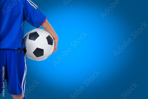 Back view of youth soccer player in blue uniform