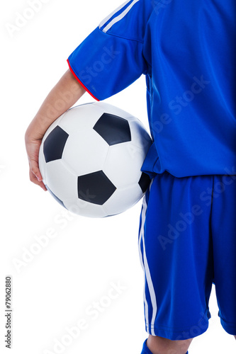 Back view of youth soccer player in blue uniform