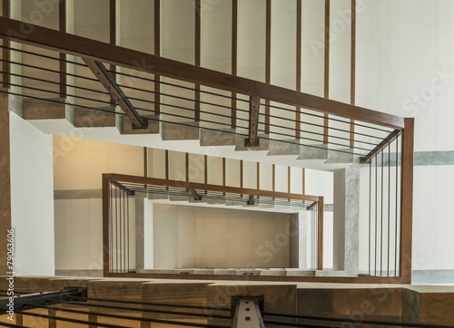 staircase with wooden rail in a modern building